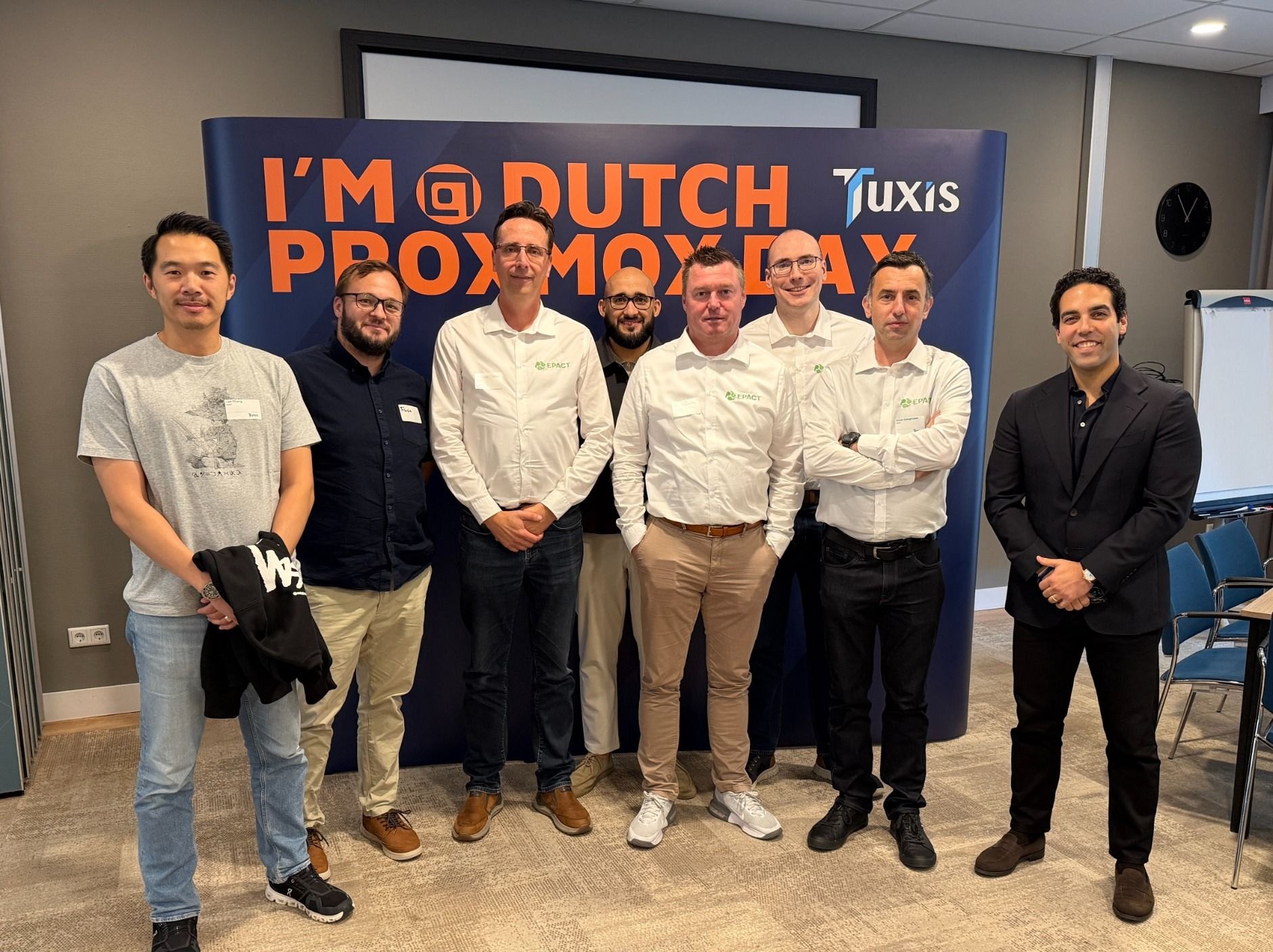 The MultiPortal team with members of EPACT standing in front of the Dutch Proxmox Day backdrop